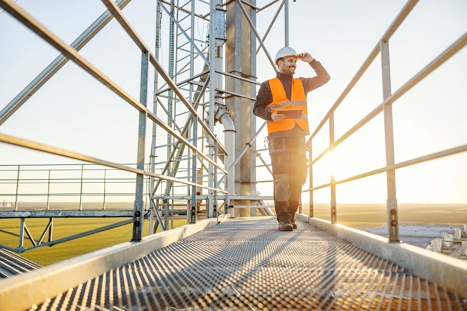 male worker on rigger equipment with high vis vest and hard hat